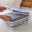 Space-saving cloth organizer for efficient fabric storage and arrangement.